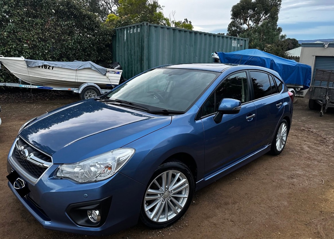 Blue Subaru Impreza hatchback washed and polished