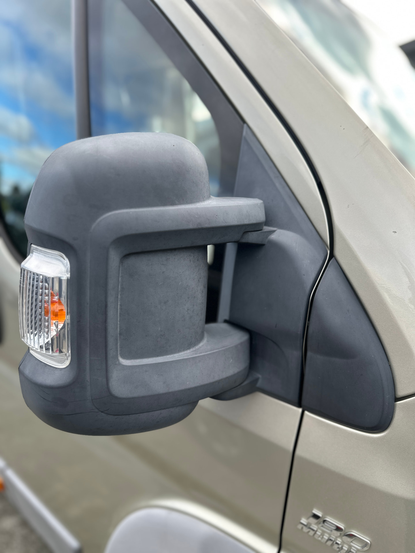 Before — Fiat Ducato side mirror housing before and after plastic trim restoration