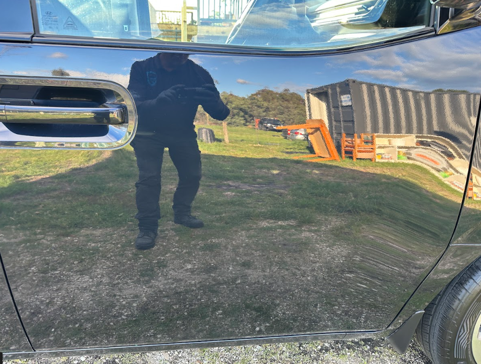 After — Scratched and swirled door panel before and after a cut and polish