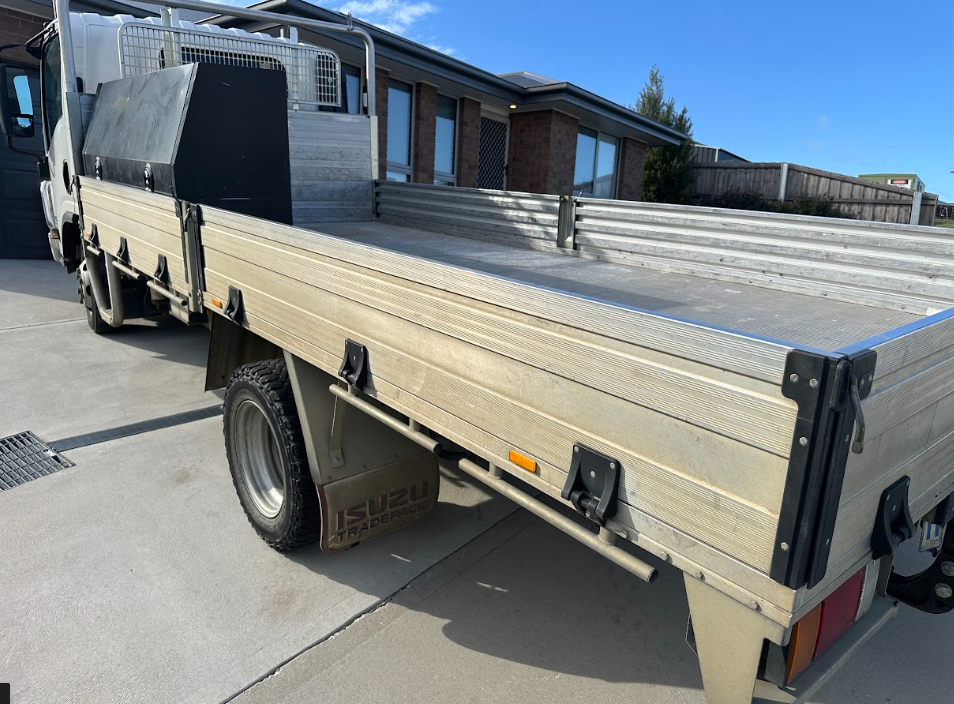 Before — Isuzu work truck flat tray before and after a professional clean