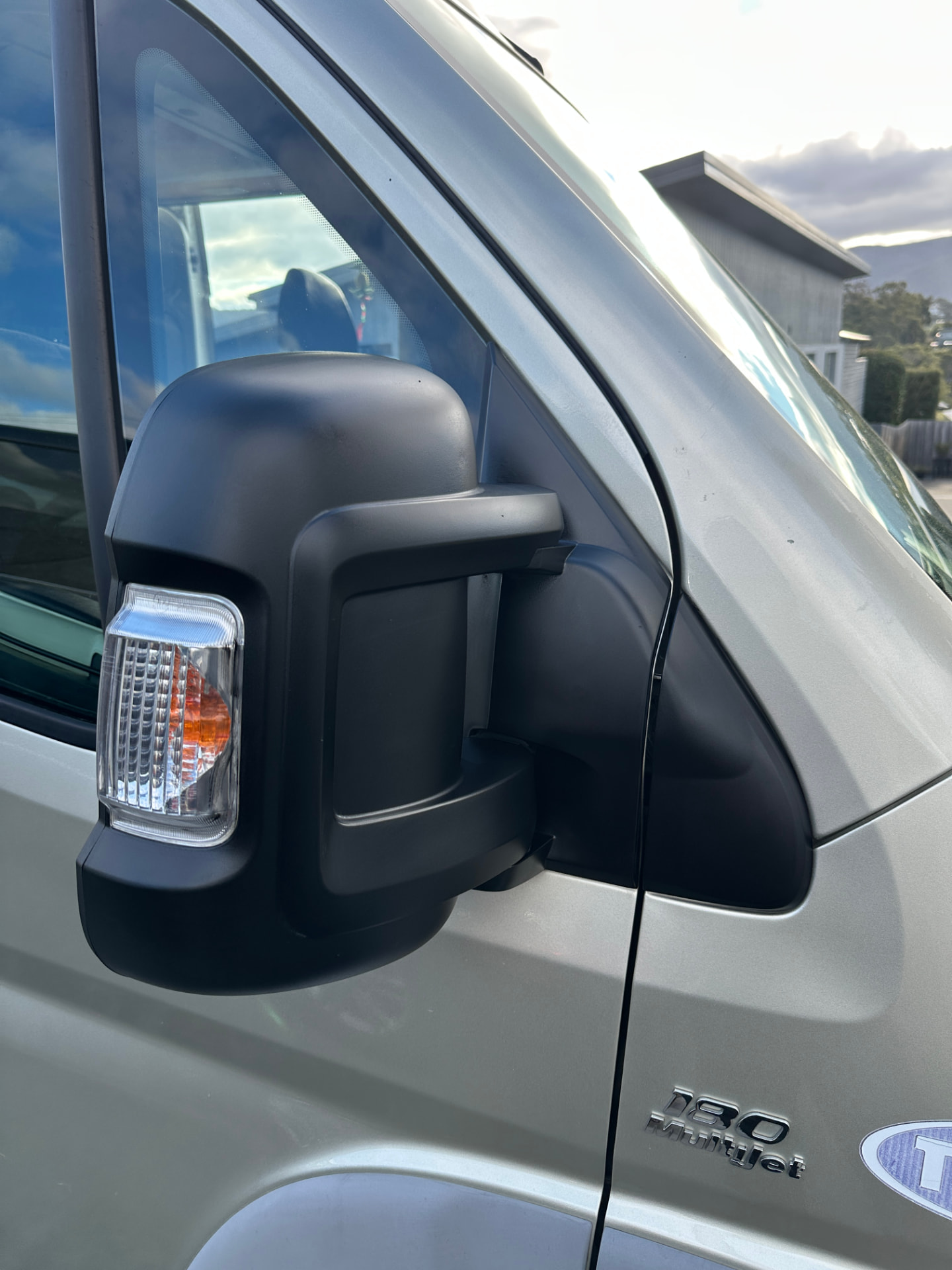 After — Fiat Ducato side mirror housing before and after plastic trim restoration
